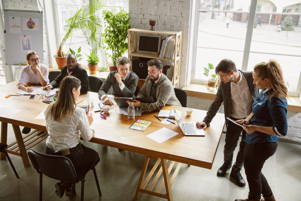 Group of young business professionals having a meeting, creative office