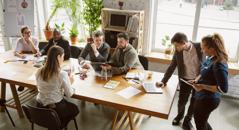 Group of young business professionals having a meeting, creative office